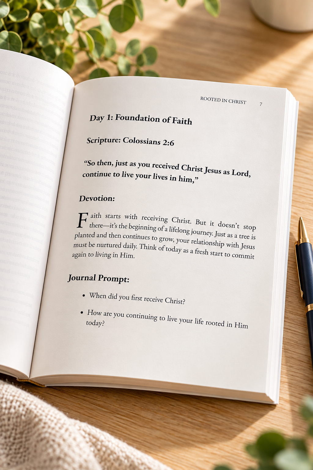 Open pages of Anchored in Christ: A 90-Day Journey of Faith, Renewal, and Growth by L. M. Duvall, featuring Day 1, “Foundation of Faith,” with Colossians 2:6, a daily devotion, and personal journal prompts. The Christian devotional paperback rests on a light wooden tabletop with soft natural lighting, greenery, and a pen.