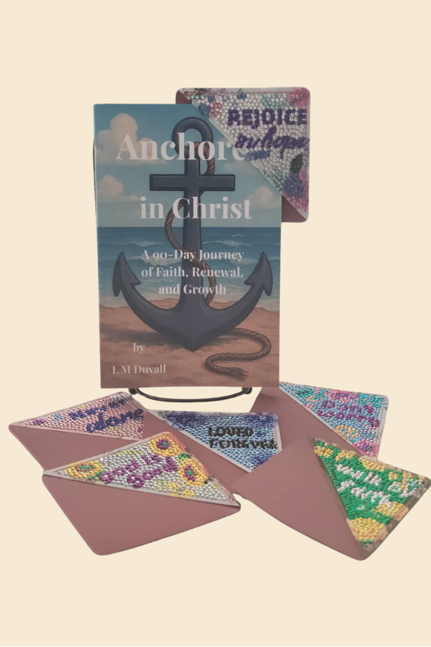 Colorful encouraging corner bookmark placed at top corner of Anchored in Christ book with additional designs below