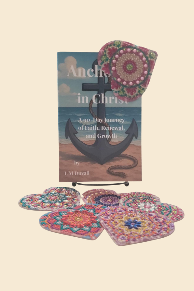 Colorful heart corner bookmark placed at top corner of Anchored in Christ book with additional designs below