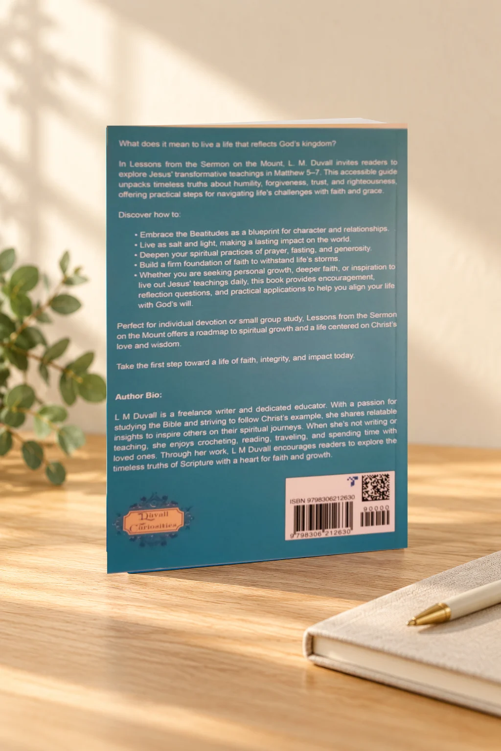 Back cover of Mountaintop Wisdom Bible study by L. M. Duvall on a light-oak table.