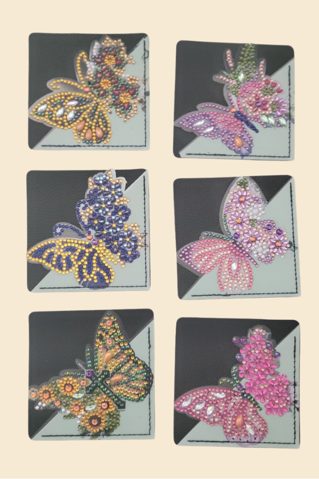 Colorful butterfly corner bookmarks with decorative designs on neutral background