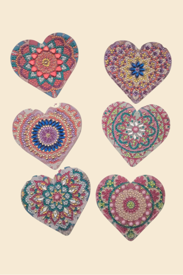 Colorful heart corner bookmarks with decorative designs on neutral background