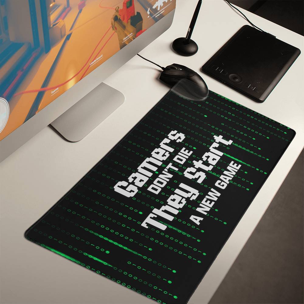 Gamers Don't Die They Start a New Game Gaming Desk Mat (white text)