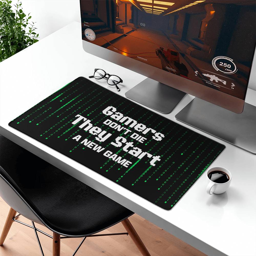 Gamers Don't Die They Start a New Game Gaming Desk Mat (white text)